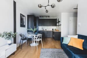 Living room with kitchen annexed in a modern studio apartment
