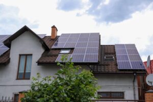 House with installed solar panels on roof.