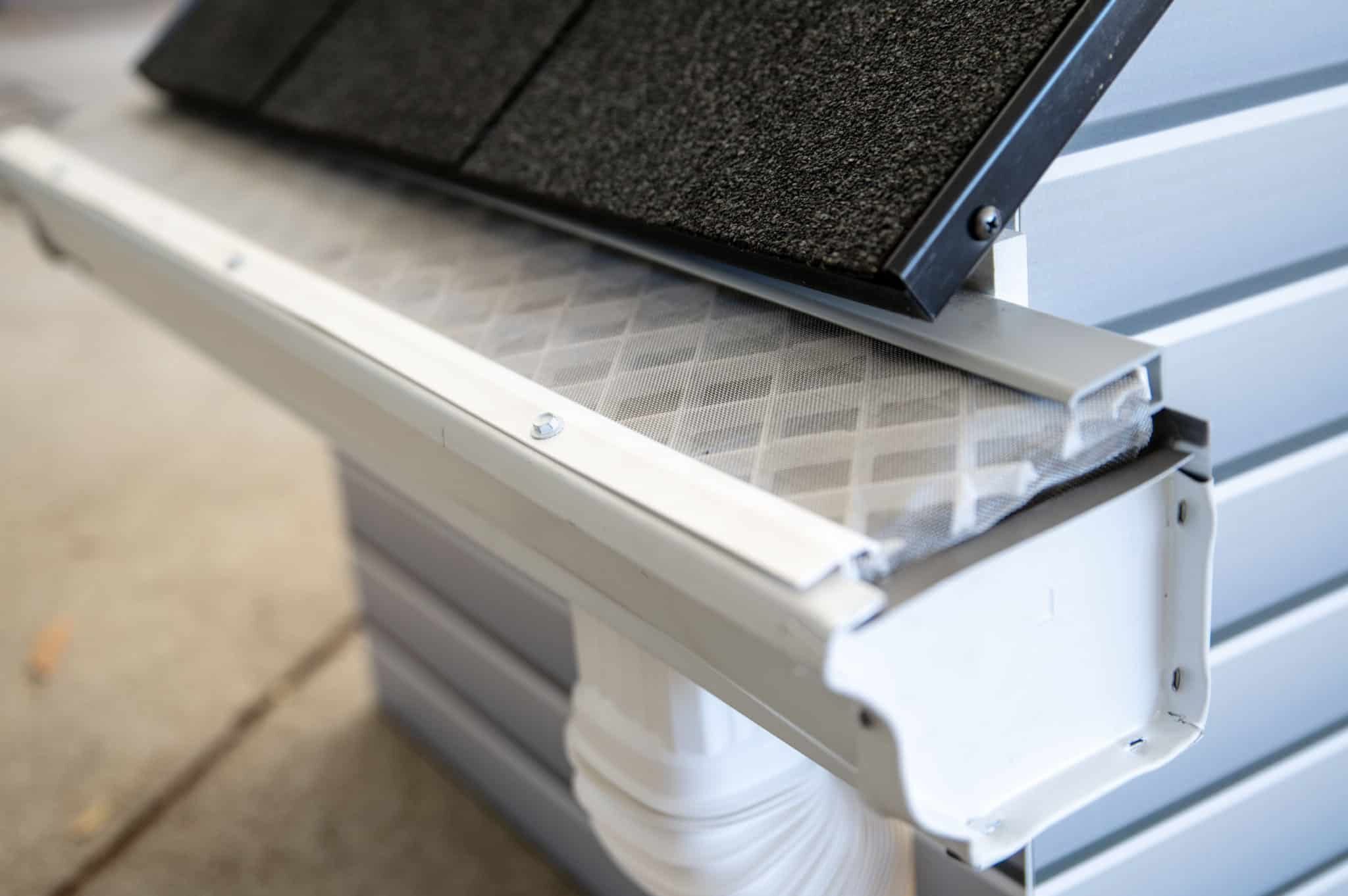 LeafFilter's floor model of a home, gutter, and gutter guard system