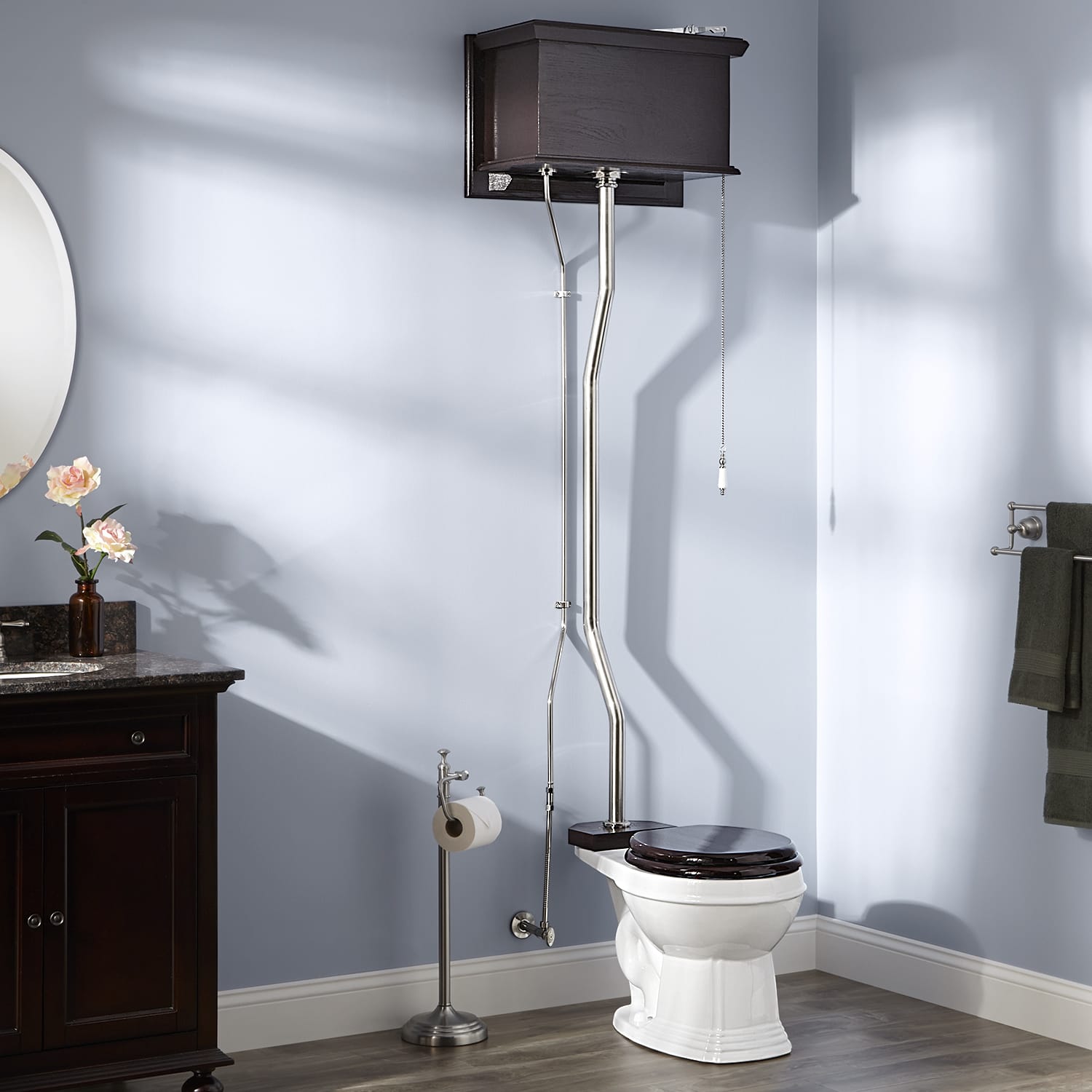 A high-tank toilet in a purple bathroom