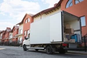Moving truck outside an apartment building preparing for an international move